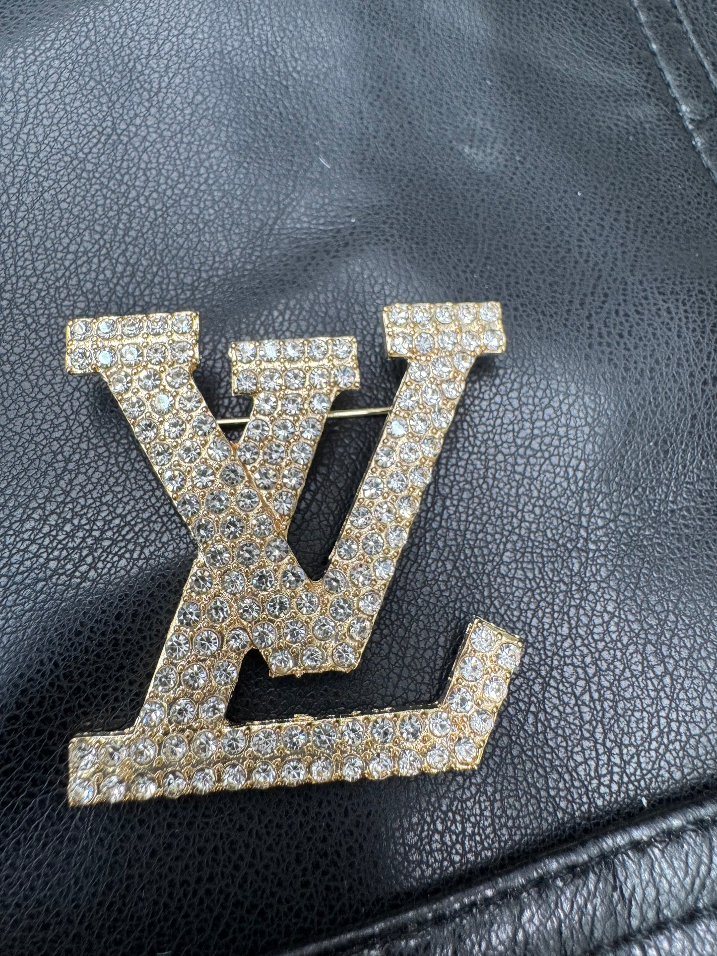LV brooch