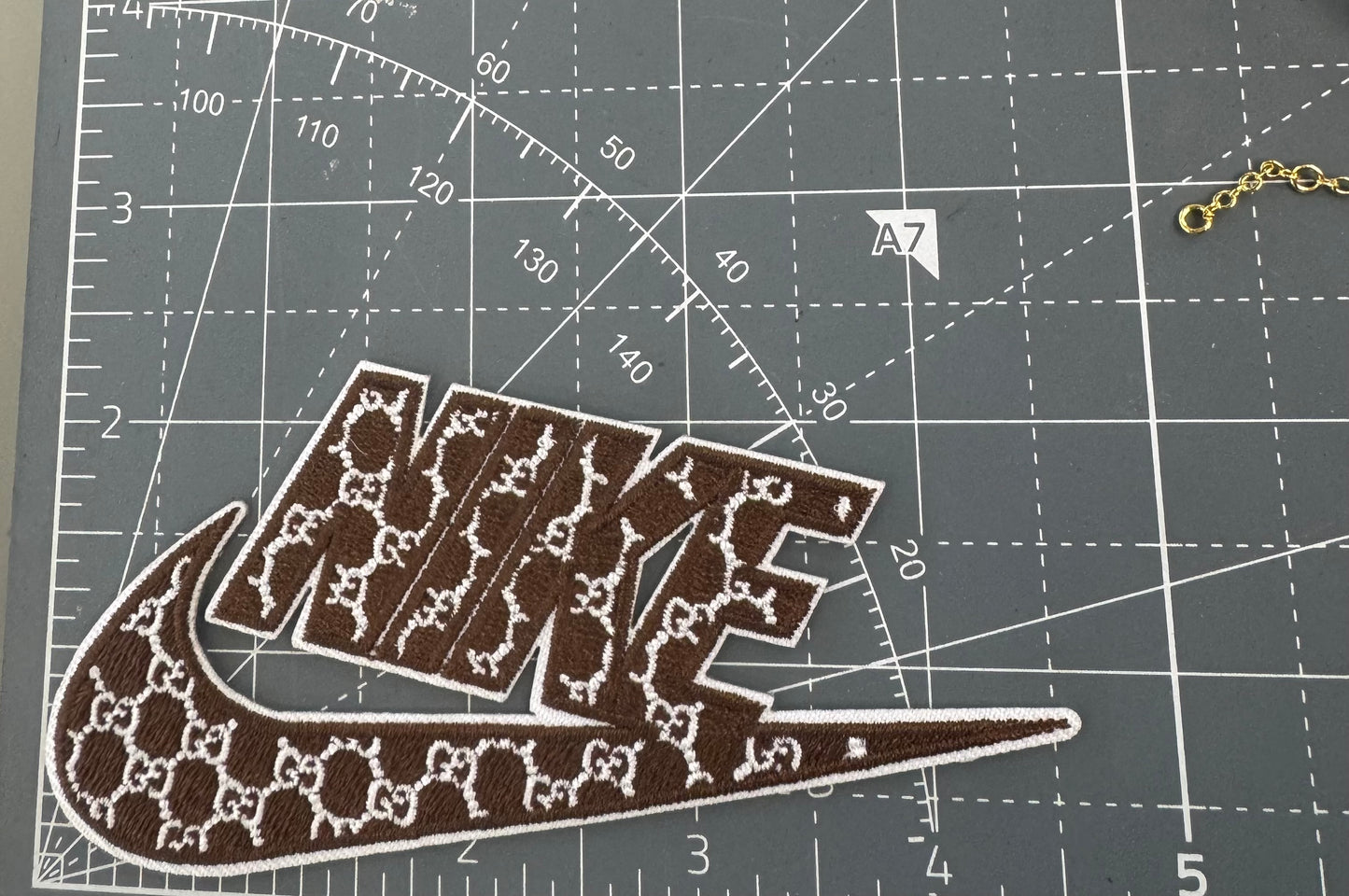 GG brown NIkE patch