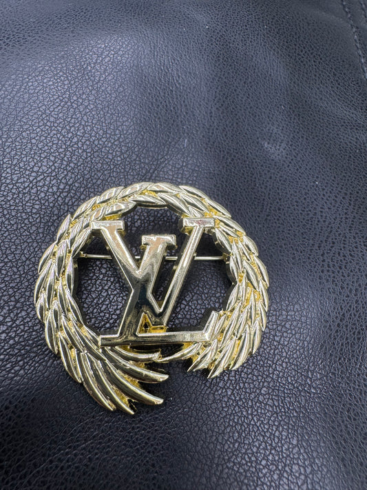 LV brooch