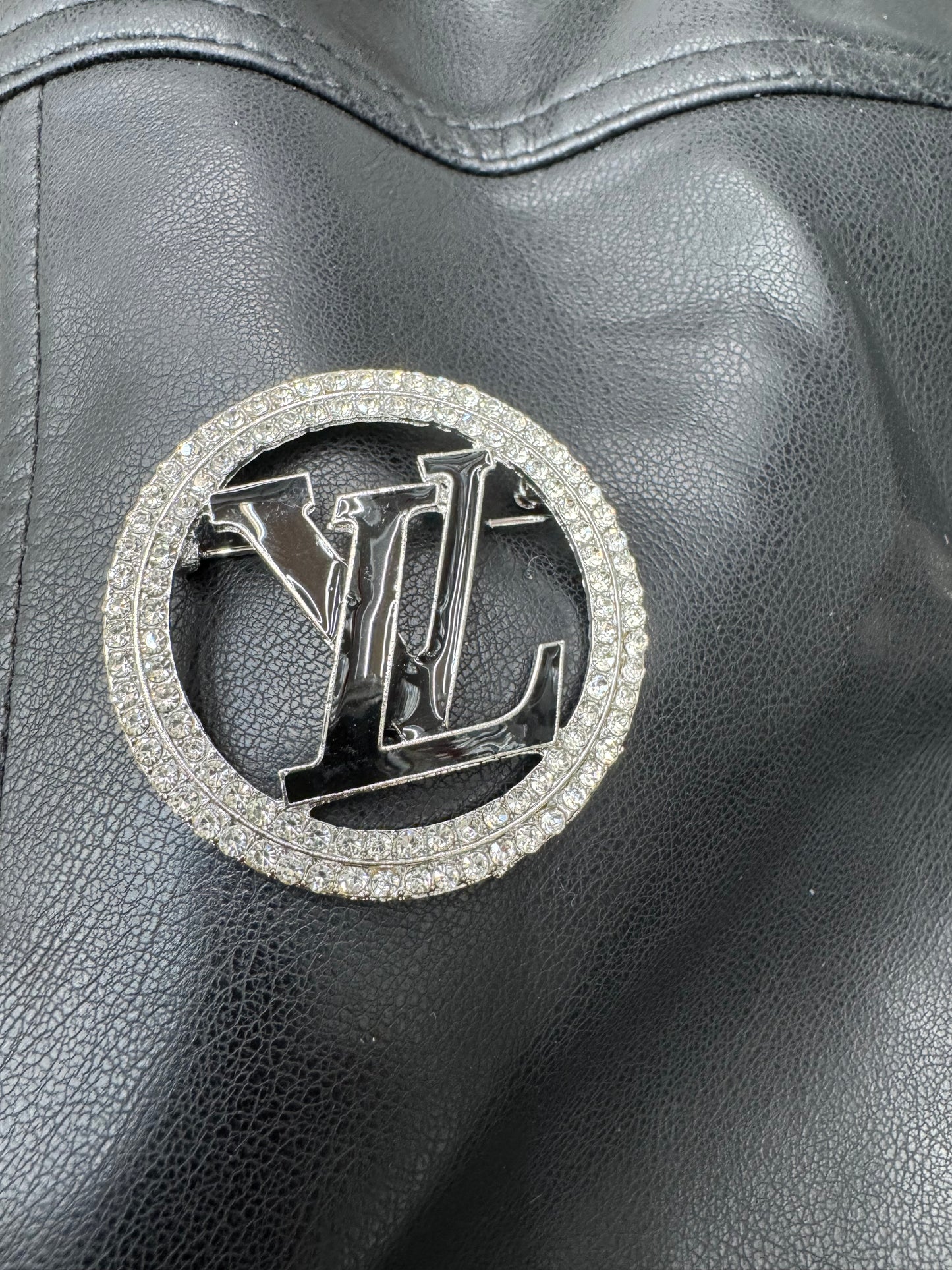 LV silver & black brooch