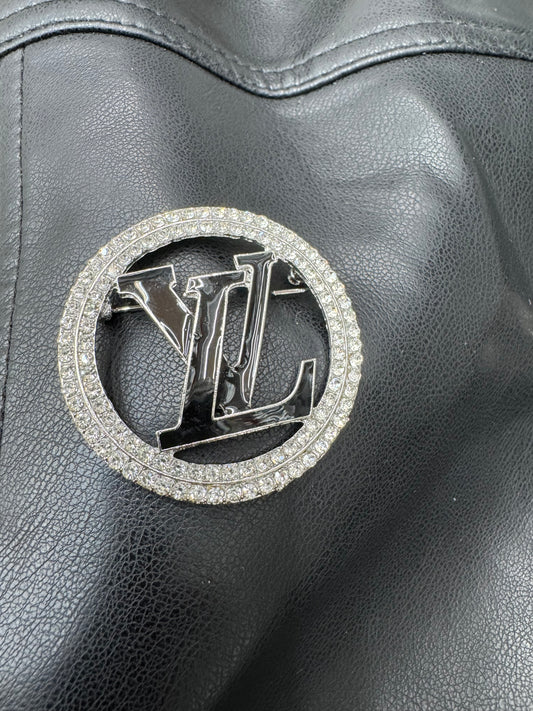 LV silver & black brooch