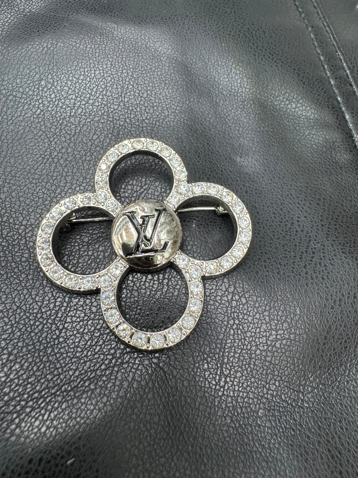 Silver LV brooches