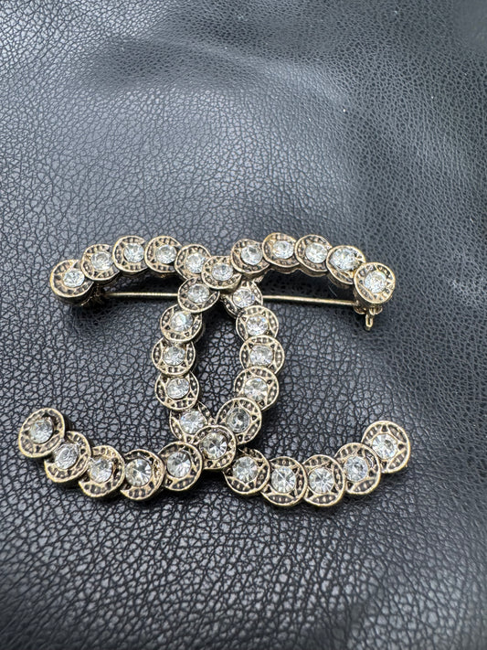 CC brooch