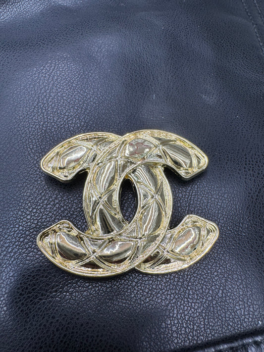 CC brooch