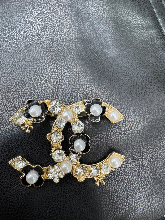 CC brooch