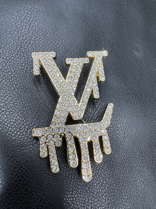 LV drip brooch