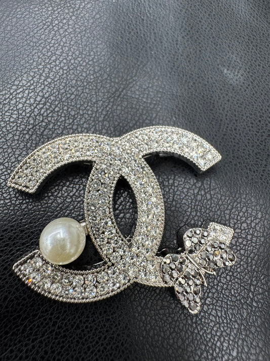 CC brooch